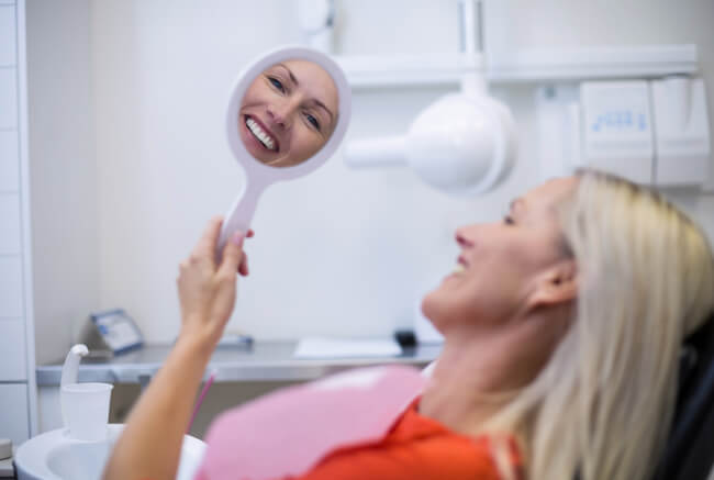 woman smiling in dentist chair